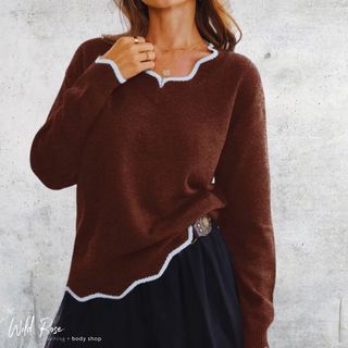 Chocolate Brown Scallop Edge Knit Sweater featuring a cosy knitted design with delicate white scalloped trim along the neckline, cuffs and hem, styled with a black skirt.