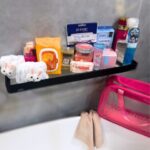Alt Text: The Luxe Ladies’ Collection featuring a pink luxury bag, skincare products, beauty brushes, face masks, body scrub, foot-care essentials, fragrance and pamper accessories.