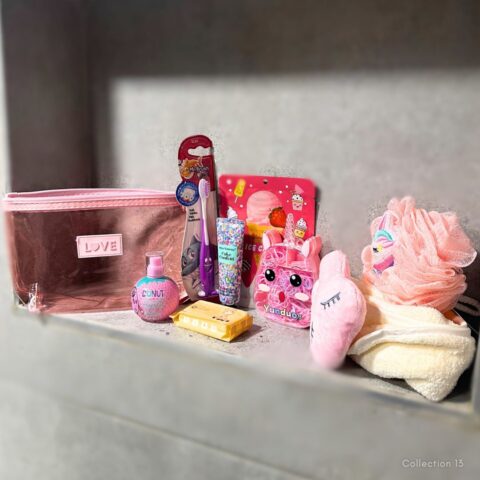 Collection 13 kids’ pamper gift set with a pink LOVE bag, colourful beauty essentials, playful bath accessories and soft pamper treats.