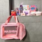 The Luxe Ladies’ Pamper Collection with a pink wash bag, body scrub, body mist, face wipes, pore refining mask, foot mask, hand cream, perfume, no-drip arm bands and soft face cloth.