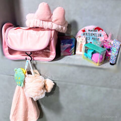 Collection 8 ladies’ pamper gift set featuring a pink wash bag, bow headband, watermelon face mask, makeup blending sponges, hand cream, soft towel and bath accessories.