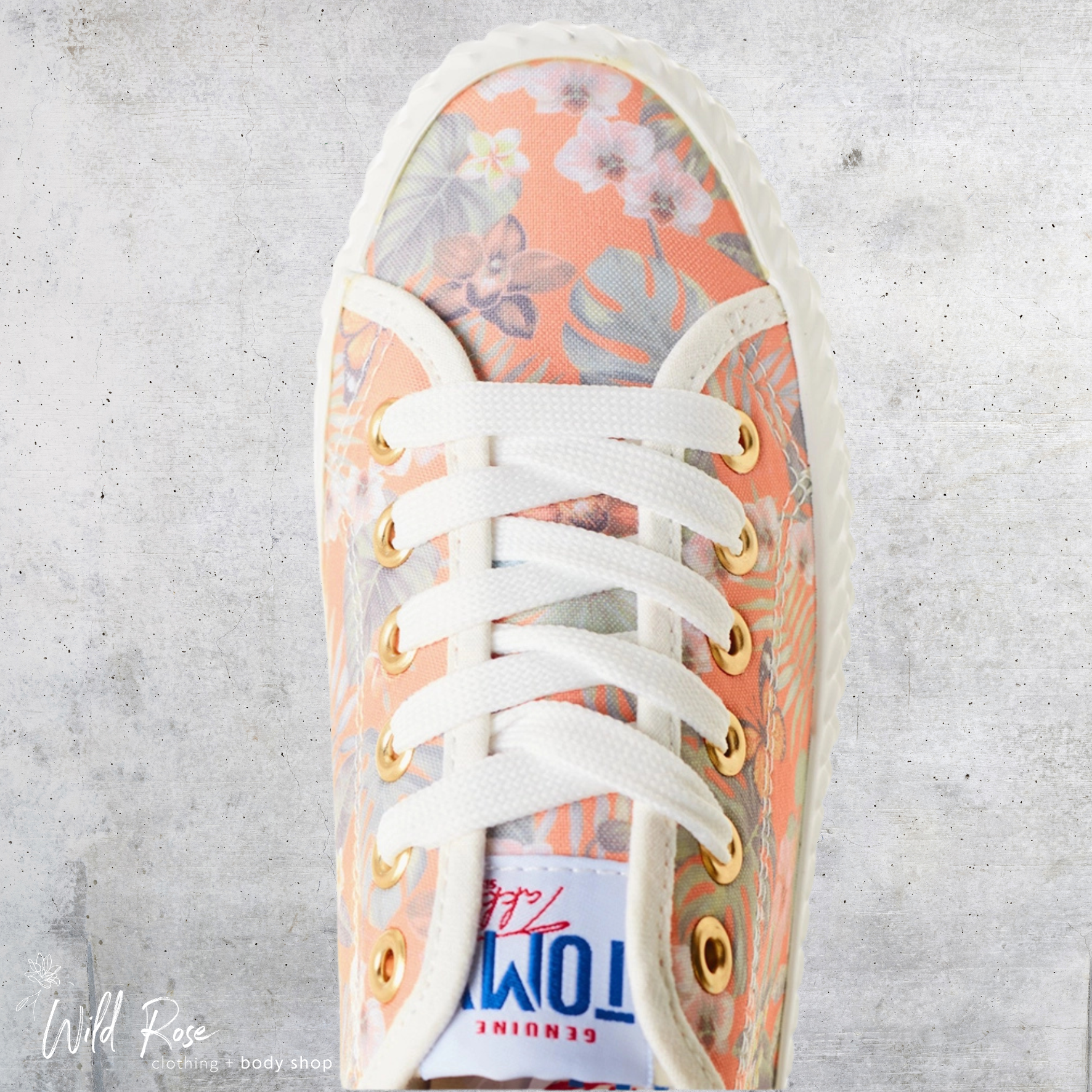 Ladies Floral Orange Tomy Sneakers – Peach Floral Lace-Up Shoes | WildRose Ladies Floral Orange Tomy Sneakers featuring a peach and orange floral print, white laces, gold-tone eyelets and a classic white sole.