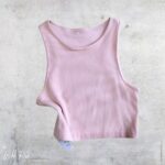 Blush Crop Top High Neck featuring a soft pink colour, ribbed texture, sleeveless design and a modern high neckline.