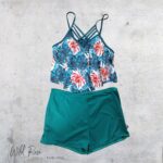 Ladies Bikini Turquoise And Floral featuring a blue tropical floral top with pink and white flowers, paired with solid turquoise bikini bottoms.