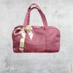 Scotty Bags Ballerina Pink Elle Overnight Duffle Bag with decorative ribbon detailing and gold-tone accent.