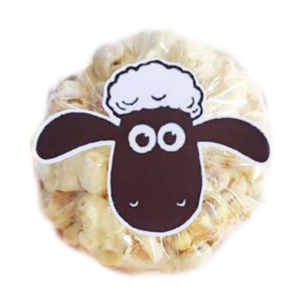 Yummy Treats Sheep Salted Caramel Popcorn in a clear bag with a cute sheep face design, perfect for party packs and themed celebrations.