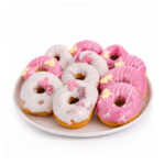 Yummy Treats Doughnuts decorated with pink and white icing, colourful sprinkles and delicate floral designs on a serving plate.