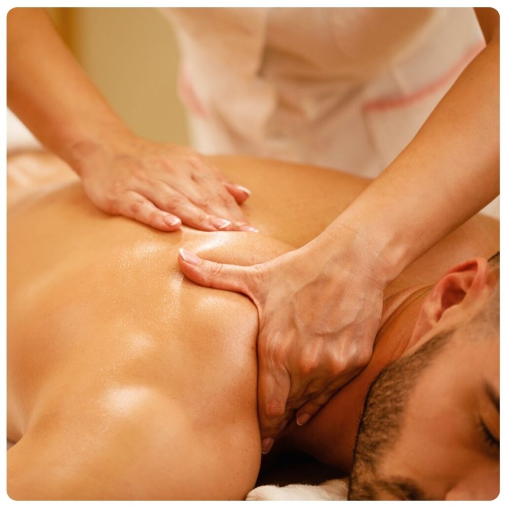 Sports Massage at The Cupcake Lounge, showing a therapist massaging a client's back to help relax tense muscles after physical activity.