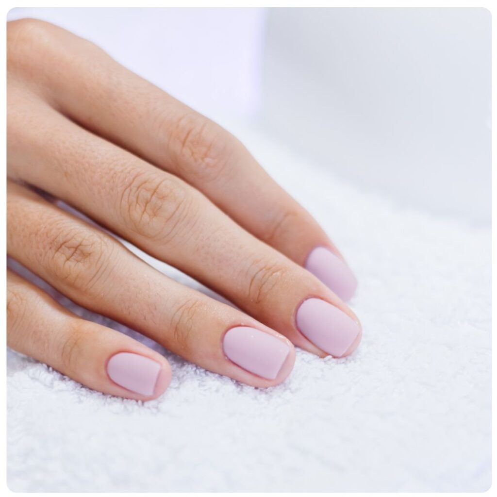 Hand Recharge + Gel at The Cupcake Lounge, featuring neatly shaped nails with a soft pink gel polish finish as part of a relaxing 40–60 minute hand treatment.