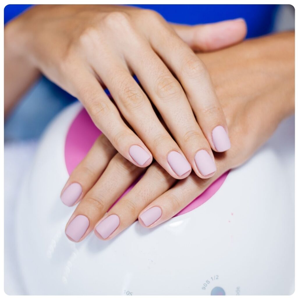Gel Hands treatment featuring beautifully manicured fingernails with glossy pale pink gel polish at The Cupcake Lounge.