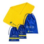 Custom School Set Hockey featuring a bright yellow personalised towel and navy-blue drawstring bags with hockey-themed designs and name details.