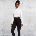 Woman wearing a white long-sleeve crop top with high-waisted black pants.