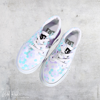 Kiddies DC floral sneakers in white with pastel blue, pink and purple flower detailing and lace-up fastening.